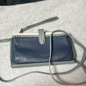 Ask crossbody wallet, never used but see pic of small ding on back.